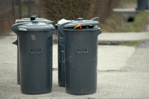 Worker wearing PPE handling recycling materials
